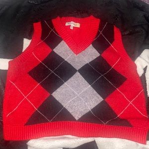 A knit sweater with no sleeve